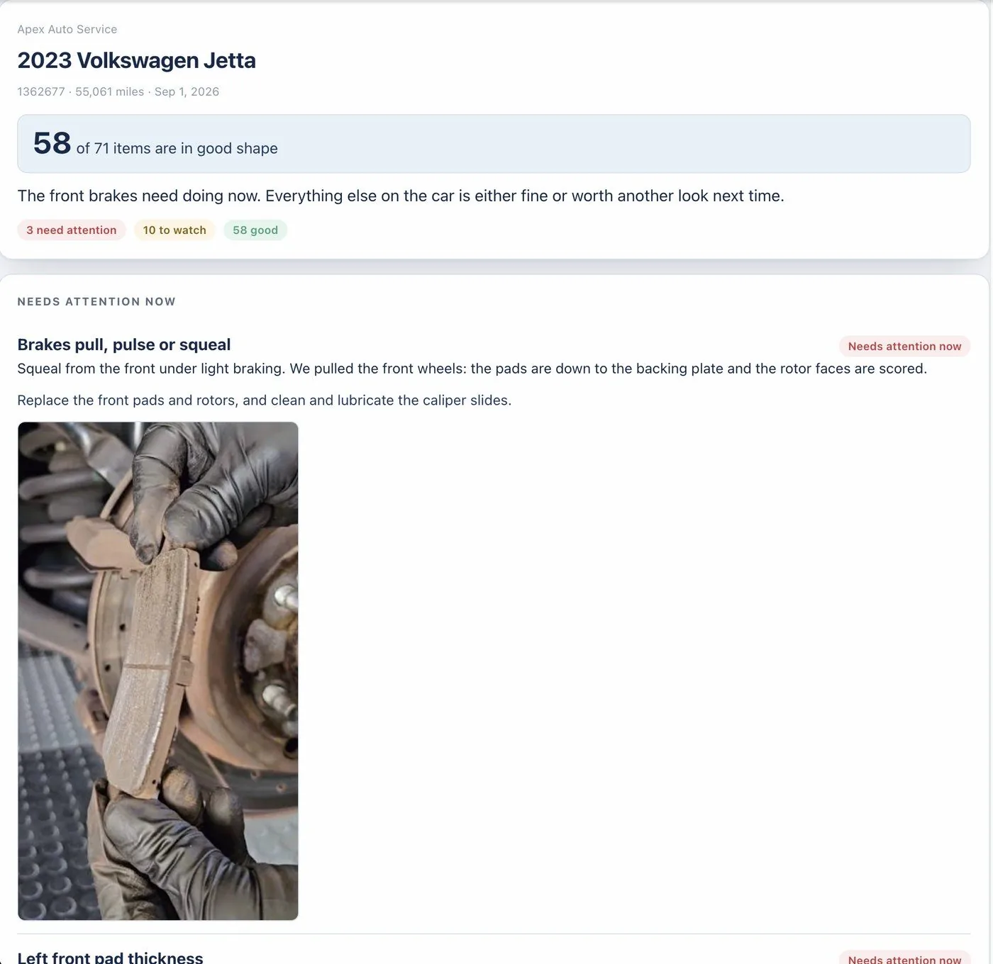 A digital inspection for a 2023 Volkswagen Jetta at 55,061 miles: 58 of 71 items in good shape, 3 needing attention and 10 to watch. The first finding, brakes pull, pulse or squeal, carries the technician's own photograph of the worn front pad held against the scored rotor, with the pad down to its backing plate.